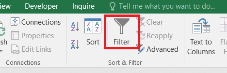 Red markup showing where to click on the Filter button in excel finding duplicate